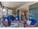 Relaxing outdoor patio space with comfortable seating, a fire pit, and a grill at 15774 W Girard Ave, Morrison, CO 80465