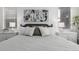 Nicely staged bedroom with lots of natural light, side tables, and neutral colors at 15774 W Girard Ave, Morrison, CO 80465