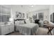 Cozy bedroom with lots of natural light, a desk, and neutral colors at 15774 W Girard Ave, Morrison, CO 80465