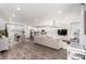 Open-concept living space combines the living room, kitchen, and dining area for easy entertaining at 15774 W Girard Ave, Morrison, CO 80465