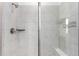 The walk-in shower features stylish tile, built in shelves, and a bench at 15774 W Girard Ave, Morrison, CO 80465