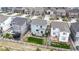 An aerial view showcasing a home, its backyard, and the surrounding neighborhood at 1933 Villageview Ln, Castle Rock, CO 80104