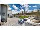 Back deck featuring outdoor lounge space, chairs, and lush green grass at 1933 Villageview Ln, Castle Rock, CO 80104