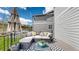 Comfortable outdoor lounge space, furnished with an umbrella for shade at 1933 Villageview Ln, Castle Rock, CO 80104
