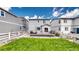 A view of the home's backyard featuring a well-manicured lawn and deck at 1933 Villageview Ln, Castle Rock, CO 80104