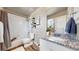 Well-lit bathroom featuring a shower, tub and granite countertop at 1933 Villageview Ln, Castle Rock, CO 80104