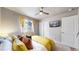 Comfortable bedroom with bright curtains, large closet, and modern TV for a cozy and functional space at 1933 Villageview Ln, Castle Rock, CO 80104