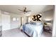 Comfortable bedroom boasts a soft bed, ceiling fan, ample space, and neutral color scheme at 1933 Villageview Ln, Castle Rock, CO 80104