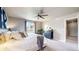 Cozy bedroom featuring a comfortable bed, large window, and dark wood furnishings for a peaceful retreat at 1933 Villageview Ln, Castle Rock, CO 80104