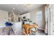 Eat-in kitchen and dining area with a wooden table and chairs, plus barstool seating at island at 1933 Villageview Ln, Castle Rock, CO 80104