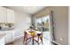Bright eat-in kitchen and dining area with sliding door access to the backyard at 1933 Villageview Ln, Castle Rock, CO 80104