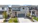 Beautiful two-story home with a two-car garage, manicured lawn, and inviting curb appeal at 1933 Villageview Ln, Castle Rock, CO 80104