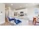 Modern kitchen with white cabinets, stainless steel appliances, granite countertops, and island with breakfast bar at 1933 Villageview Ln, Castle Rock, CO 80104