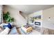 Cozy living room boasts a modern fireplace, wood floors, and plenty of natural light at 1933 Villageview Ln, Castle Rock, CO 80104
