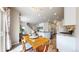 Bright open-concept living space with a dining table, island, and stairs at 1933 Villageview Ln, Castle Rock, CO 80104