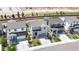 An aerial street view of a home, its front yard, and the neighboring houses at 1933 Villageview Ln, Castle Rock, CO 80104