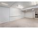 Large basement with neutral carpet and paint, providing a blank canvas for customization and flexible living space at 8236 E Phillips Pl, Centennial, CO 80112