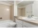 A clean bathroom featuring a bath and shower, toilet, large mirror, and sink at 8236 E Phillips Pl, Centennial, CO 80112