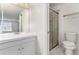 A bright bathroom showcases a white sink, shower, and toilet at 8236 E Phillips Pl, Centennial, CO 80112