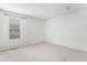Bedroom with neutral carpet and a window offering natural light at 8236 E Phillips Pl, Centennial, CO 80112