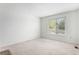 Neutral bedroom with a window provides natural light at 8236 E Phillips Pl, Centennial, CO 80112