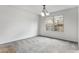 Neutral bedroom features large window letting in natural light at 8236 E Phillips Pl, Centennial, CO 80112
