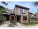 Charming townhome with brick facade, gray siding and well maintained landscaping at 8236 E Phillips Pl, Centennial, CO 80112