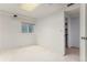 Neutral room featuring light walls, a window for natural light, and a closet space at 8236 E Phillips Pl, Centennial, CO 80112