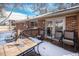 Backyard patio features an outdoor table and chairs at 3083 S Xanthia St, Denver, CO 80231