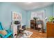 Home office with a desk, bookshelves, and hardwood floors at 3083 S Xanthia St, Denver, CO 80231