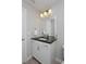 Bathroom featuring a granite vanity top and great lighting at 719 Robert St, Longmont, CO 80503