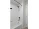 Bathroom with a tiled shower over the tub and great lighting at 719 Robert St, Longmont, CO 80503