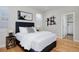 Bedroom featuring hardwood floors, decorative wall art and stylish furnishings at 719 Robert St, Longmont, CO 80503
