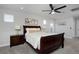 Bedroom featuring carpet, fan, and windows at 719 Robert St, Longmont, CO 80503