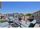 Relaxing deck area with comfortable outdoor seating and views of the community at 719 Robert St, Longmont, CO 80503