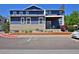 Stylish two-story home with a covered patio and manicured landscaping at 719 Robert St, Longmont, CO 80503