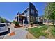 Attractive home exterior with a second story balcony and inviting curb appeal on a sunny day at 719 Robert St, Longmont, CO 80503