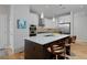 Modern kitchen with stainless steel appliances, large island, and stylish backsplash at 719 Robert St, Longmont, CO 80503