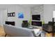 Comfortable living room featuring hardwood floors, a modern fireplace, and stylish decor at 719 Robert St, Longmont, CO 80503