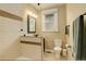 Stylish bathroom boasts tiled walls, modern lighting, and a functional vanity for a sleek design at 848 Harrison St, Denver, CO 80206