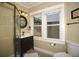 Bright bathroom featuring a glass shower, modern vanity, and ample natural light for a refreshing feel at 848 Harrison St, Denver, CO 80206