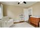 Cozy bedroom with hardwood floors, a comfortable chair, and a changing table for Gathering-friendly living at 848 Harrison St, Denver, CO 80206
