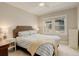 Serene bedroom featuring a plush bed, neutral decor, and bright natural light for peaceful relaxation at 848 Harrison St, Denver, CO 80206