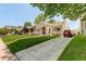Inviting stucco home boasting a well-kept lawn and a spacious driveway at 848 Harrison St, Denver, CO 80206