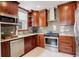 Well-lit kitchen with stainless steel appliances, updated cabinets, and granite countertops at 848 Harrison St, Denver, CO 80206