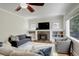 Comfortable living room with inviting seating, a fireplace, and built-in bookshelves at 848 Harrison St, Denver, CO 80206