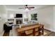 Cozy living room featuring fireplace, built-in bookshelves and oversized windows at 848 Harrison St, Denver, CO 80206
