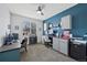 Functional home office featuring dual workspaces, ample storage, and a bright window view at 16844 E Lake Pl, Aurora, CO 80016