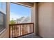 An outdoor balcony space offers a view of the neighborhood rooftops and blue sky at 10578 E Jewell Ave, Aurora, CO 80012