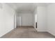 The bright carpeted bedroom features neutral walls, two entry points, and base molding at 10578 E Jewell Ave, Aurora, CO 80012